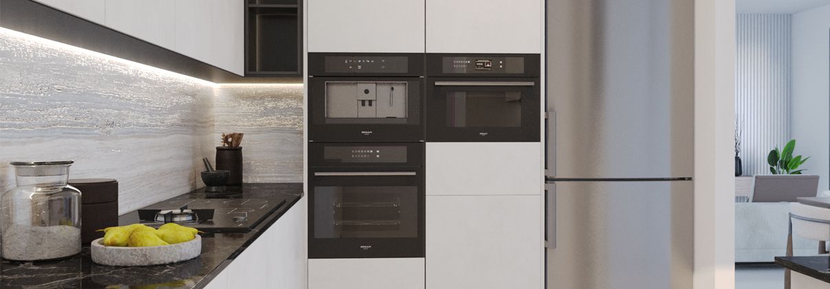 Modern kitchen with built-in ovens and dark stone countertop